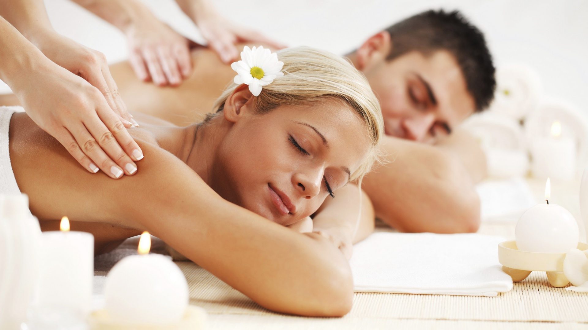 Young couple is having a back massage at the spa centre. 

[url=http://www.istockphoto.com/search/lightbox/9786786][img]http://dl.dropbox.com/u/40117171/couples.jpg[/img][/url]