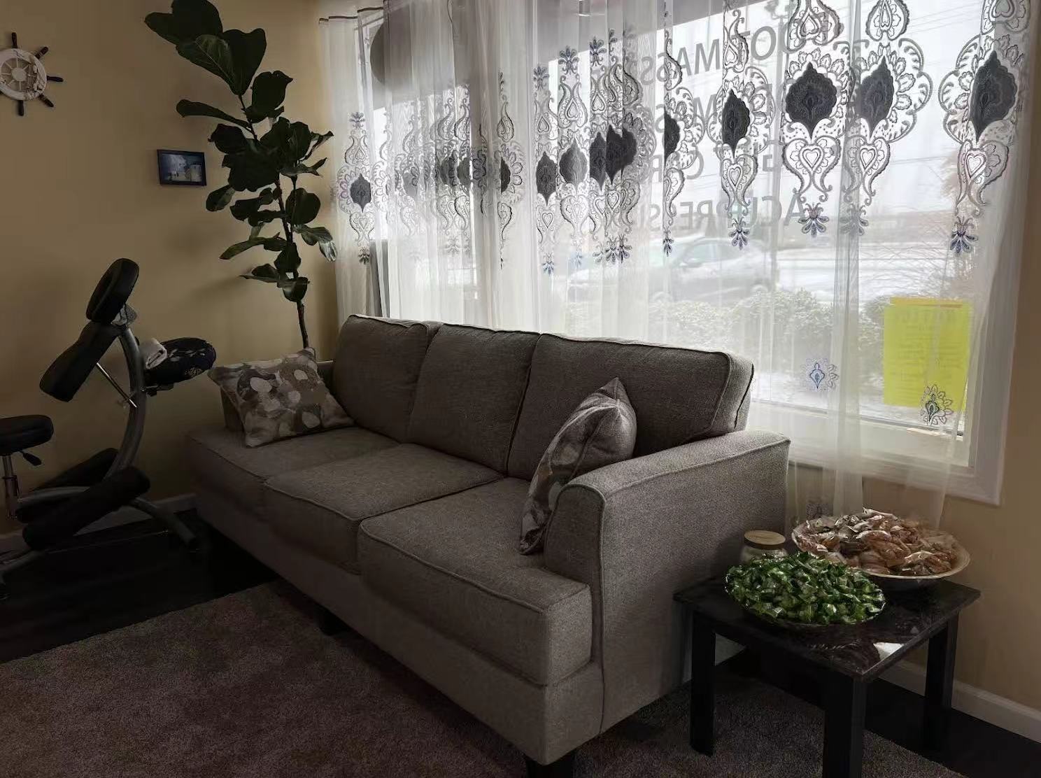 Quiet waiting lounge with sofa and window light inside Four Seasons Spa