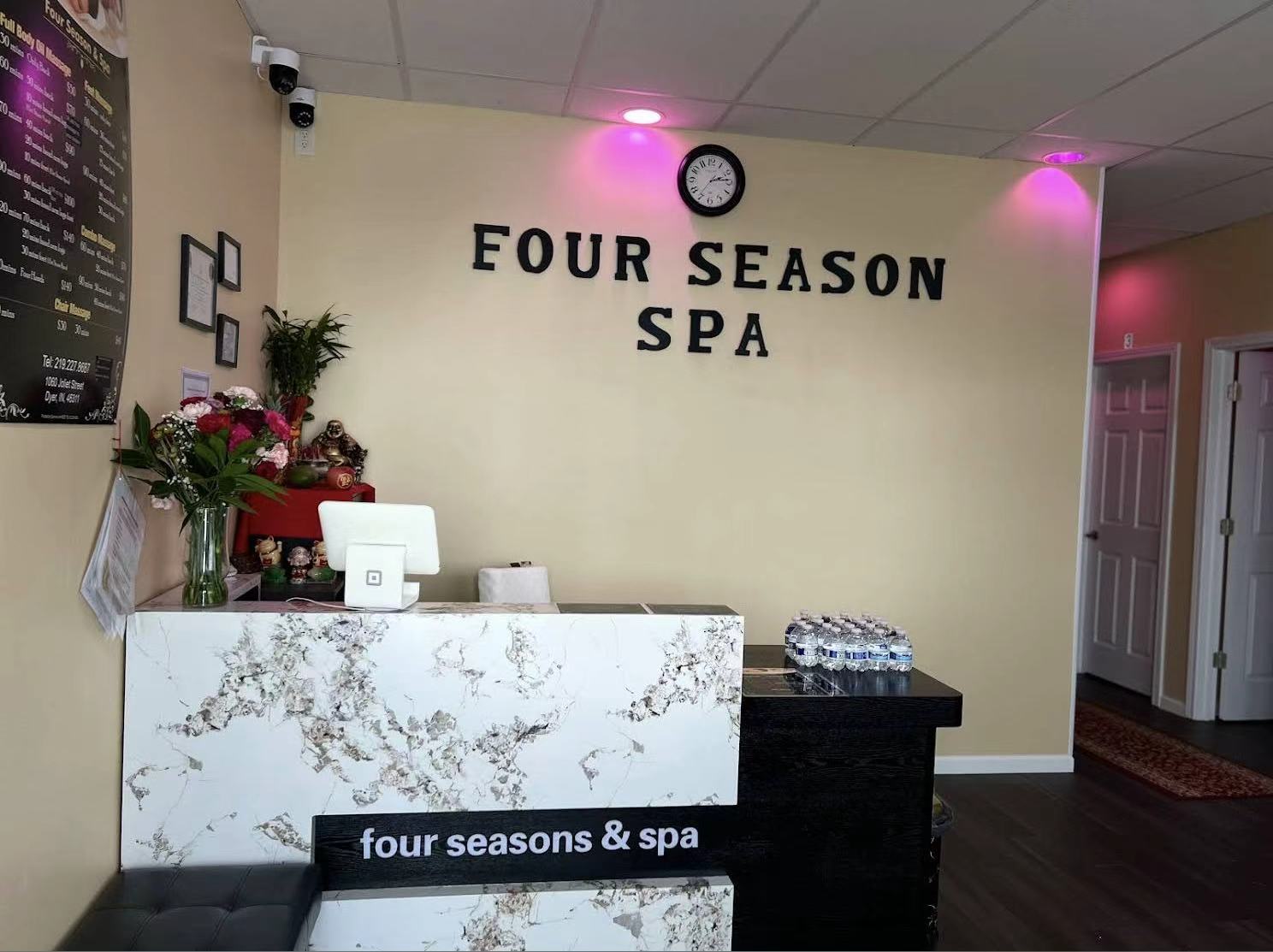 Four Seasons Spa reception desk with front counter and logo wall