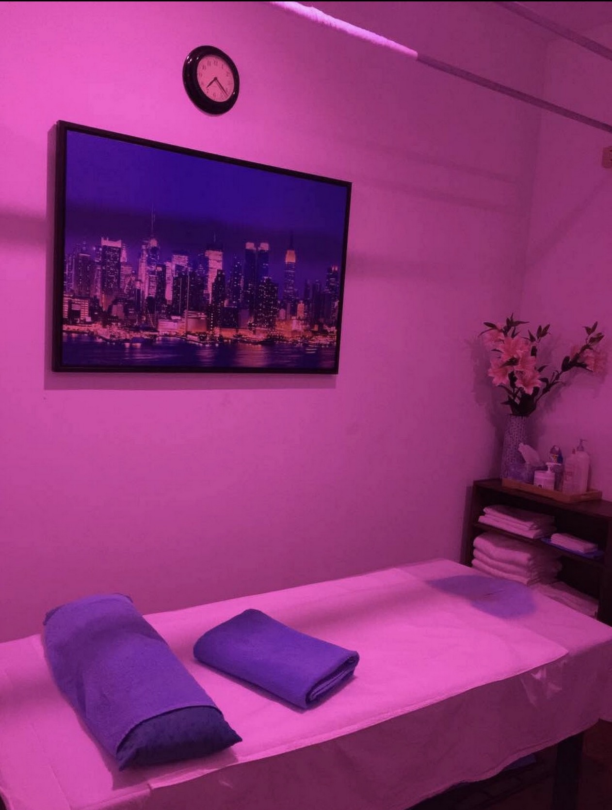 Private massage room with treatment table and folded towels at Four Seasons Spa